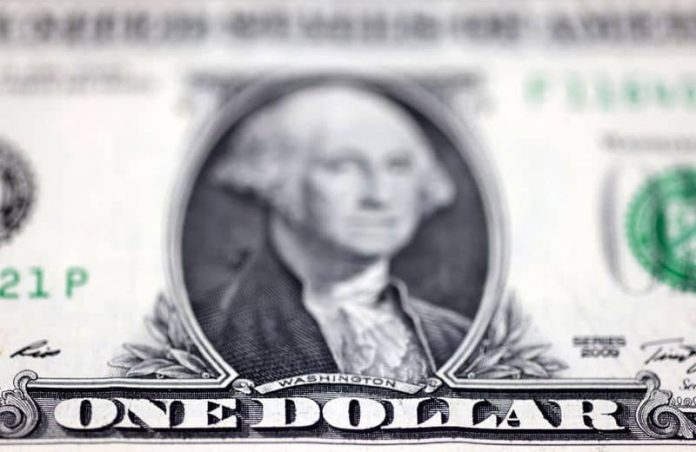 Dollar edges up on credit report, sterling hovers near one year high