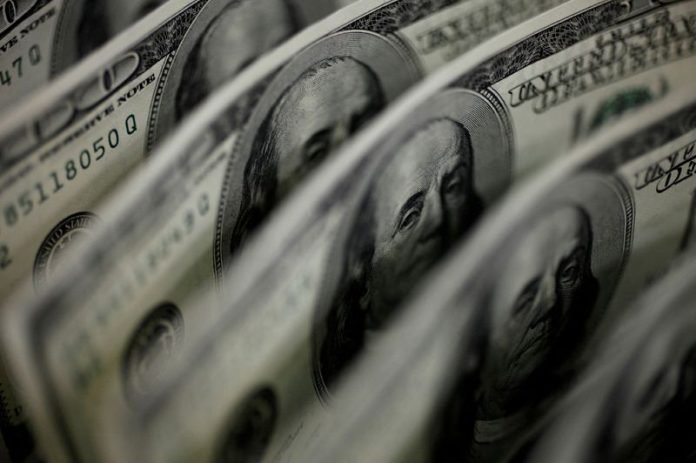 US dollar drops to three week low as Fed rate hikes nearly done